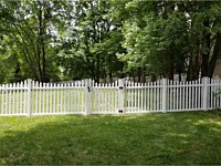 <b>5' high white pvc picket fence in contemporary style with pointed pickets and new england post caps with a concave pattern-2</b>